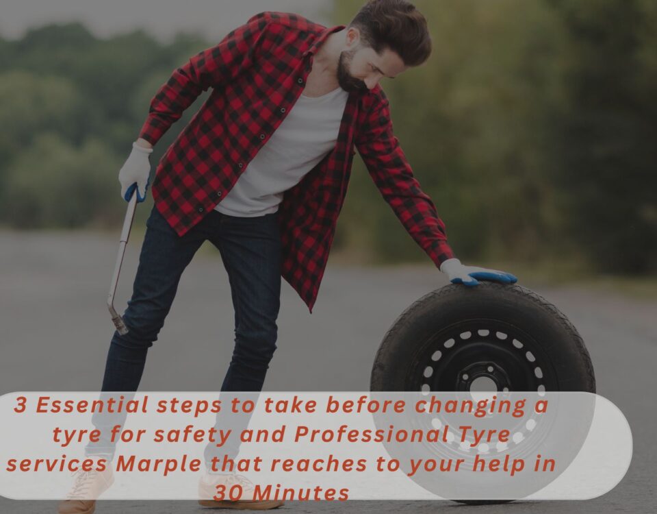 A tyre mechanic holding a tyre fitting tool in his one hand and keeping his other hand on a new tyre 3 essential steps to take before changing a tyre for safety and Professional Tyre services Marple that reaches to your help in 30 Minutes